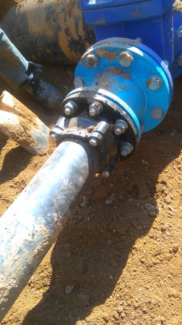 110mm HDPE main water supply installation across street for fuel station