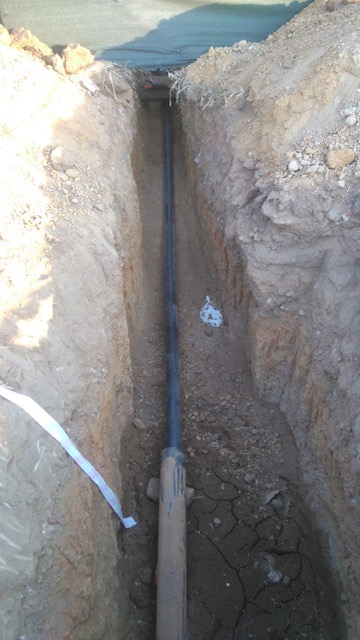 110mm HDPE main water supply installation across street for fuel station