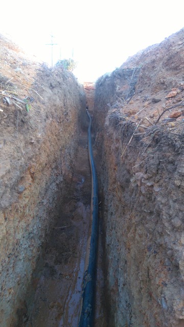 110mm HDPE main water supply installation across street for fuel station